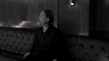 Movie still from “The Smile - Wall Of Eyes” (2023), directed by Paul Thomas Anderson – Medium shot, Low angle