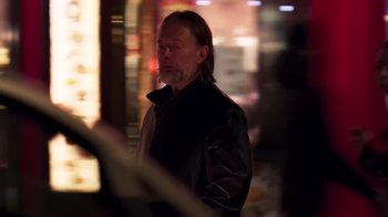Movie still from “The Smile - Wall Of Eyes” (2023), directed by Paul Thomas Anderson – Close Up shot, Over the shoulder angle