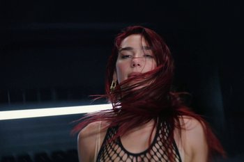 Movie still from “Dua Lipa - Houdini” (2023), directed by Manu Cossu – Close Up shot, Low angle