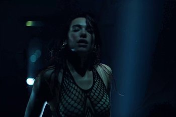 Movie still from “Dua Lipa - Houdini” (2023), directed by Manu Cossu – Medium shot, Low angle