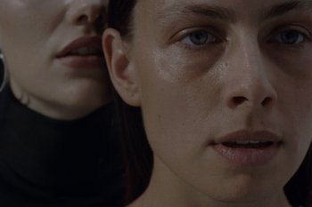 Movie still from “Annet, Nobodylisten - Vrstvy” (2023), directed by Jara Moravec – Extreme Close Up shot, Low angle