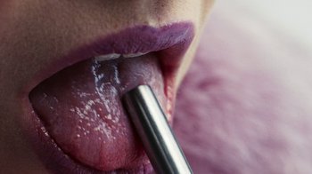 Movie still from “Audrey Nuna - Locket” (2023), directed by Valentin Petit – Extreme Close Up shot, Overhead angle