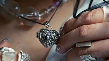 Movie still from “Audrey Nuna - Locket” (2023), directed by Valentin Petit – Extreme Close Up shot, Overhead angle