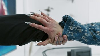 Movie still from “Audrey Nuna - Locket” (2023), directed by Valentin Petit – Extreme Close Up shot, Overhead angle