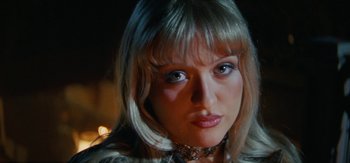 Movie still from “DJ Suzy - Wings” (2023), directed by SWIM CLUB – Close Up shot, Low angle