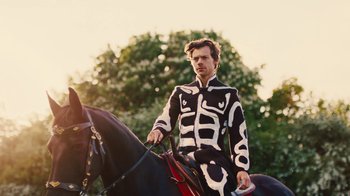 Movie still from “Harry Styles - Daylight” (2023), directed by Tanu Muiño – Medium shot, Low angle