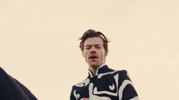 Movie still from “Harry Styles - Daylight” (2023), directed by Tanu Muiño – Medium shot, Low angle