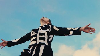 Movie still from “Harry Styles - Daylight” (2023), directed by Tanu Muiño – Medium shot, Low angle