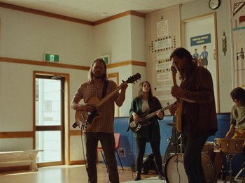 Movie still from “The Teskey Brothers - Take My Heart” (2023), directed by W.A.M. Bleakley – Wide shot, Low angle