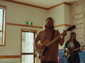 Movie still from “The Teskey Brothers - Take My Heart” (2023), directed by W.A.M. Bleakley – Medium shot, Over the shoulder angle