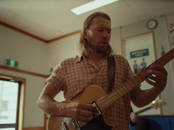 Movie still from “The Teskey Brothers - Take My Heart” (2023), directed by W.A.M. Bleakley – Medium shot, Low angle
