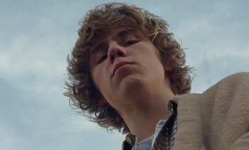 Movie still from “The Kid LAROI - …Growing Up” (2023), directed by Ramez Silyan – Close Up shot, Low angle