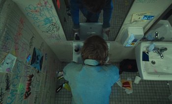 Movie still from “The Kid LAROI - …Growing Up” (2023), directed by Ramez Silyan – Medium shot, Overhead angle