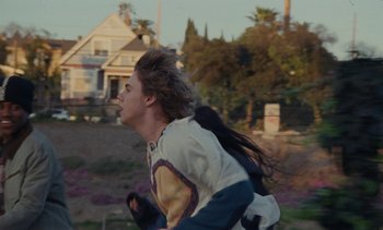 Movie still from “The Kid LAROI - …Growing Up” (2023), directed by Ramez Silyan – Medium shot, Low angle