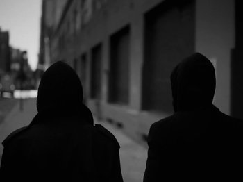 Movie still from “Depeche Mode - Ghosts Again” (2023), directed by Anton Corbijn – Medium shot, Low angle