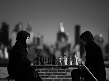 Movie still from “Depeche Mode - Ghosts Again” (2023), directed by Anton Corbijn – Medium shot, Low angle