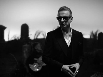 Movie still from “Depeche Mode - Ghosts Again” (2023), directed by Anton Corbijn – Medium shot, Low angle