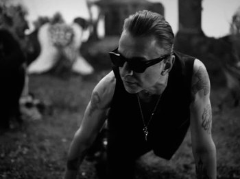 Movie still from “Depeche Mode - Ghosts Again” (2023), directed by Anton Corbijn – Medium shot, Low angle
