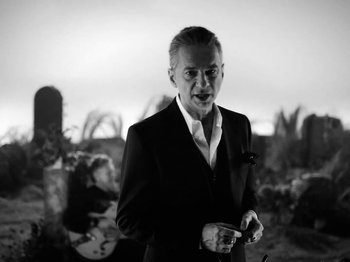 Movie still from “Depeche Mode - Ghosts Again” (2023), directed by Anton Corbijn – Medium shot, Low angle