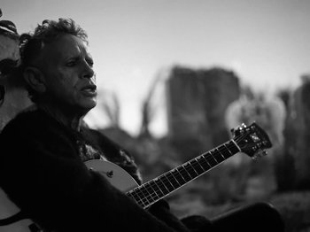 Movie still from “Depeche Mode - Ghosts Again” (2023), directed by Anton Corbijn – Medium shot, Low angle