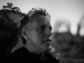 Movie still from “Depeche Mode - Ghosts Again” (2023), directed by Anton Corbijn – Close Up shot, Low angle