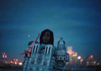 Movie still from “Bakar - Noun” (2022), directed by Machine Operated – Medium shot, Low angle