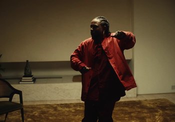 Movie still from “Kendrick Lamar - Rich Spirit” (2022), directed by Calmatic – Medium shot, Low angle