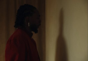 Movie still from “Kendrick Lamar - Rich Spirit” (2022), directed by Calmatic – Medium shot, Over the shoulder angle