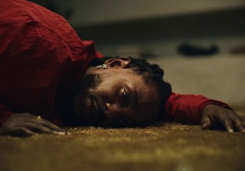 Movie still from “Kendrick Lamar - Rich Spirit” (2022), directed by Calmatic – Close Up shot, Overhead angle