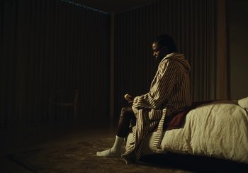 Movie still from “Kendrick Lamar - Rich Spirit” (2022), directed by Calmatic – Medium shot, Low angle