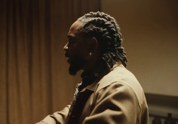 Movie still from “Kendrick Lamar - Rich Spirit” (2022), directed by Calmatic – Close Up shot, Over the shoulder angle
