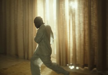 Movie still from “Kendrick Lamar - Rich Spirit” (2022), directed by Calmatic – Medium shot, Low angle