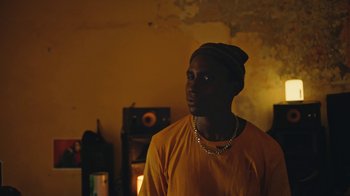 Movie still from “The Blaze - Dreamer” (2022), directed by The Blaze – Medium shot, Low angle