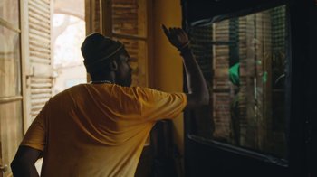 Movie still from “The Blaze - Dreamer” (2022), directed by The Blaze – Medium shot, Over the shoulder angle