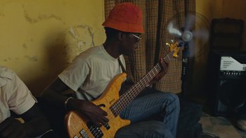Movie still from “The Blaze - Dreamer” (2022), directed by The Blaze – Medium shot, Low angle