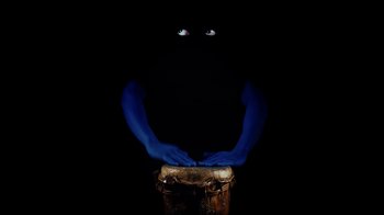Movie still from “Tshegue - Mais” (2022), directed by Ibrahim Kamara – Extreme Close Up shot, Overhead angle