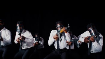 Movie still from “Tshegue - Mais” (2022), directed by Ibrahim Kamara – Medium shot, Low angle