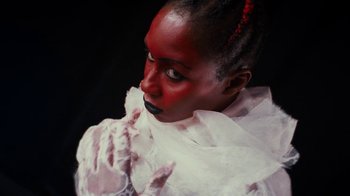 Movie still from “Tshegue - Mais” (2022), directed by Ibrahim Kamara – Close Up shot, Low angle