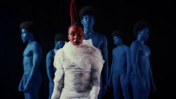 Movie still from “Tshegue - Mais” (2022), directed by Ibrahim Kamara – Medium shot, Low angle