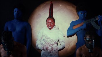 Movie still from “Tshegue - Mais” (2022), directed by Ibrahim Kamara – Medium shot, Low angle