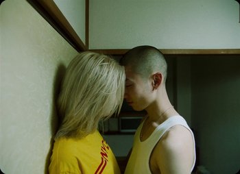 Movie still from “ZNTNDR - Untitled Us” (2022), directed by Jovan Todorović – Close Up shot, Overhead angle