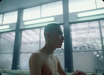Movie still from “ZNTNDR - Untitled Us” (2022), directed by Jovan Todorović – Close Up shot, Low angle