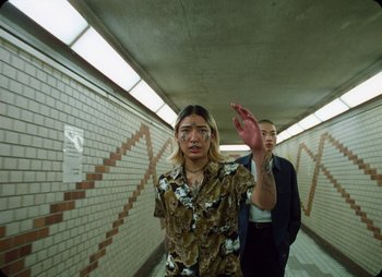 Movie still from “ZNTNDR - Untitled Us” (2022), directed by Jovan Todorović – Medium shot, Low angle