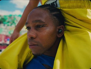 Movie still from “Elton John, Britney Spears - Hold Me Closer” (2022), directed by Tanu Muiño – Close Up shot, Low angle