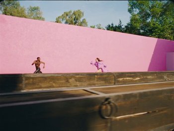 Movie still from “Elton John, Britney Spears - Hold Me Closer” (2022), directed by Tanu Muiño – Wide shot, Low angle