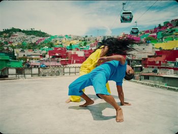 Movie still from “Elton John, Britney Spears - Hold Me Closer” (2022), directed by Tanu Muiño – Wide shot, Overhead angle