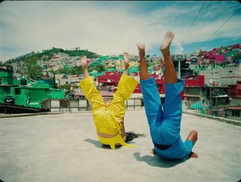 Movie still from “Elton John, Britney Spears - Hold Me Closer” (2022), directed by Tanu Muiño – Wide shot, Overhead angle