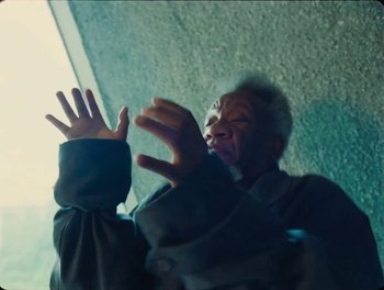 Movie still from “Elton John, Britney Spears - Hold Me Closer” (2022), directed by Tanu Muiño – Medium shot, Low angle