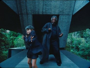 Movie still from “Elton John, Britney Spears - Hold Me Closer” (2022), directed by Tanu Muiño – Medium shot, High angle