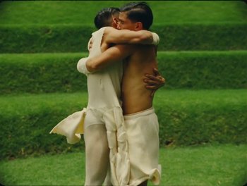 Movie still from “Elton John, Britney Spears - Hold Me Closer” (2022), directed by Tanu Muiño – Medium shot, Low angle